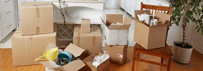 Packed moving boxes and household items in a kitchen before move-out or move-in cleaning, Evansville, IN.